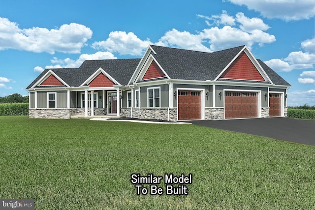 view of front of property with stone siding, a front lawn, board and batten siding, and driveway