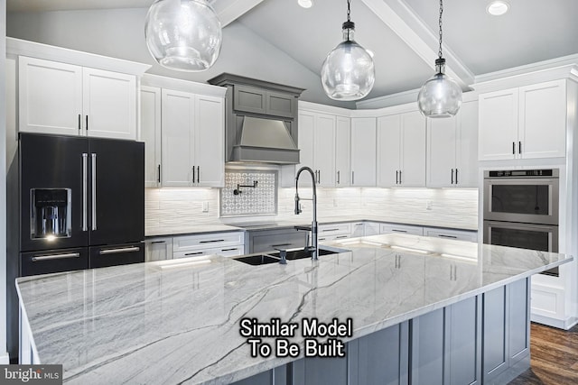 kitchen featuring white cabinetry, hanging light fixtures, and light stone countertops