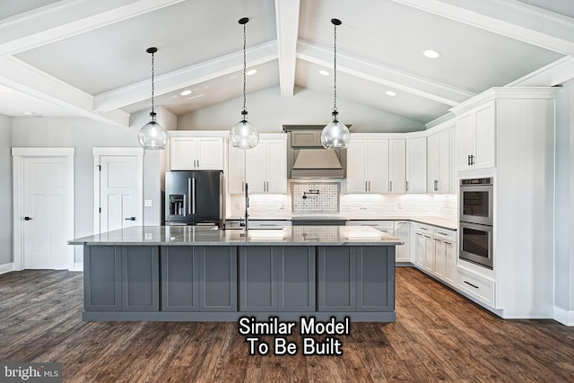 kitchen with fridge with ice dispenser, an island with sink, dark stone countertops, and white cabinetry