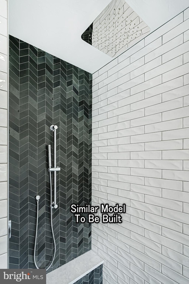 bathroom featuring tiled shower