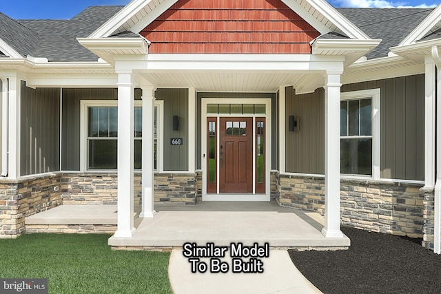 doorway to property with covered porch, stone siding, and roof with shingles