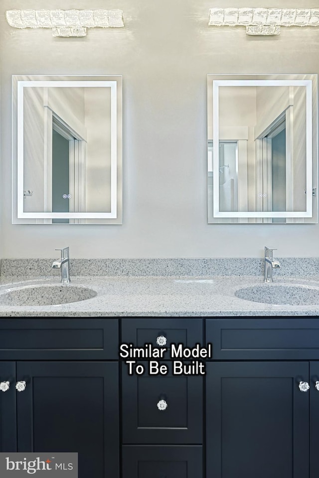 bathroom with double vanity and a sink