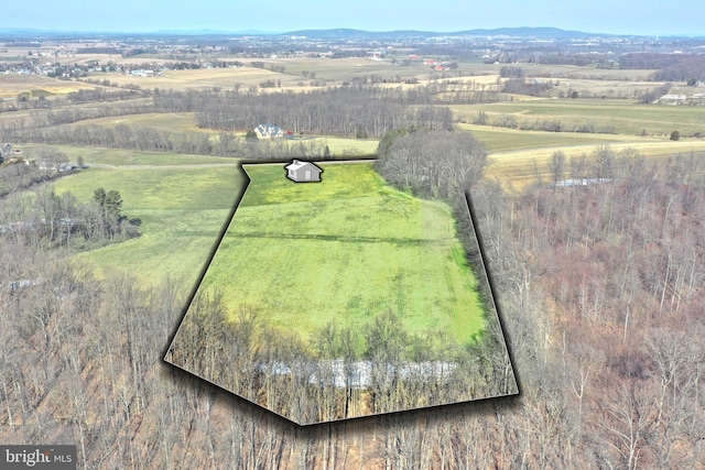 birds eye view of property with a rural view