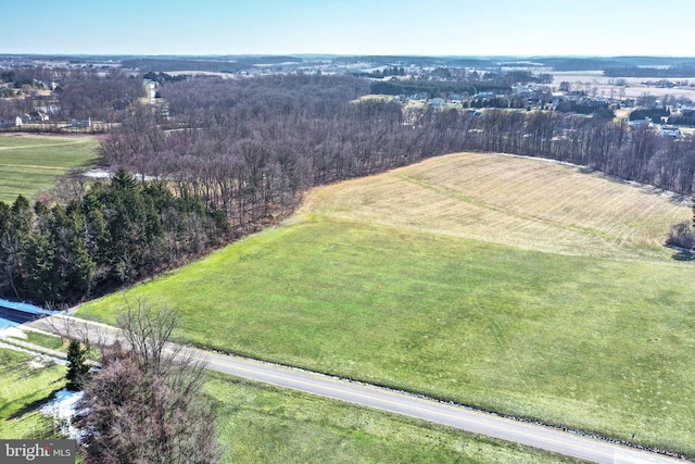 birds eye view of property featuring a rural view