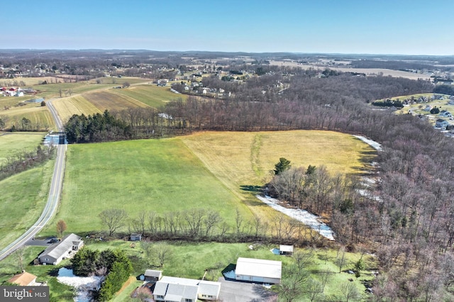 birds eye view of property with a rural view