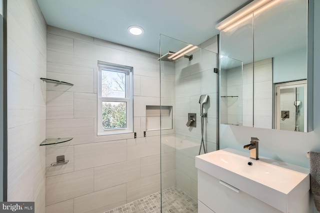 bathroom with vanity and walk in shower