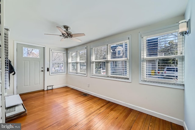 interior space featuring ceiling fan and visible vents