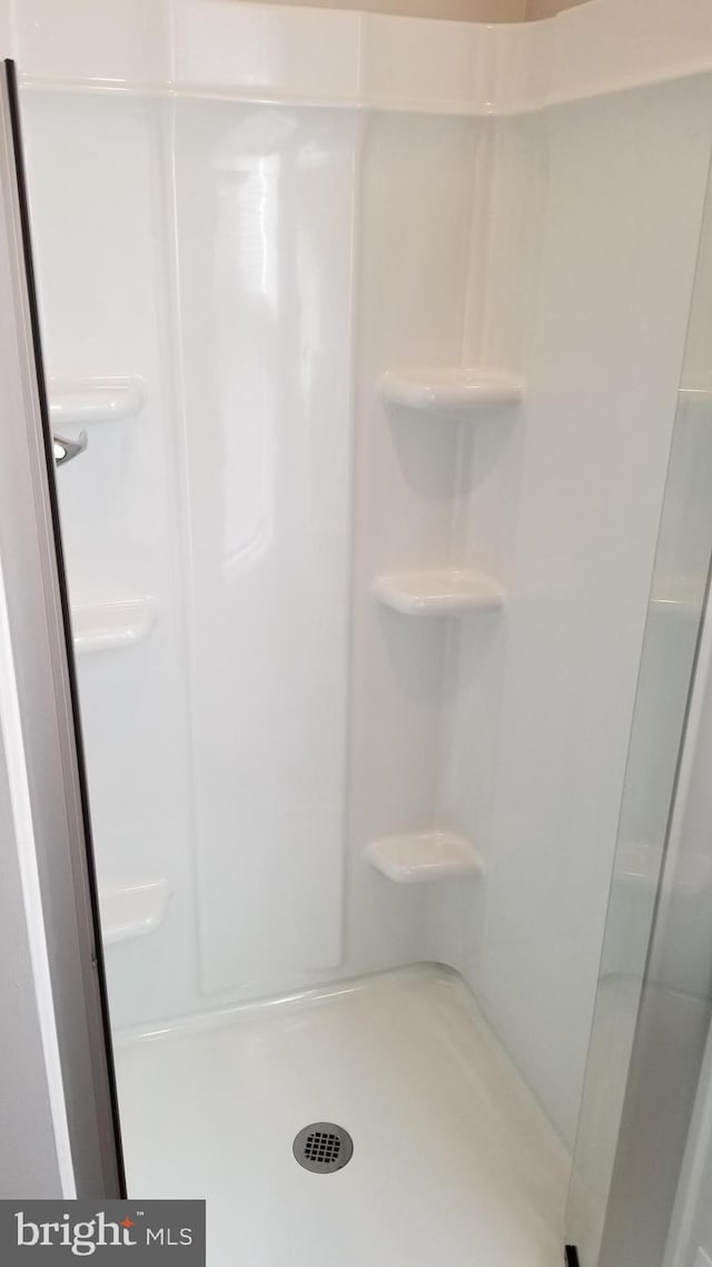 full bathroom with a stall shower