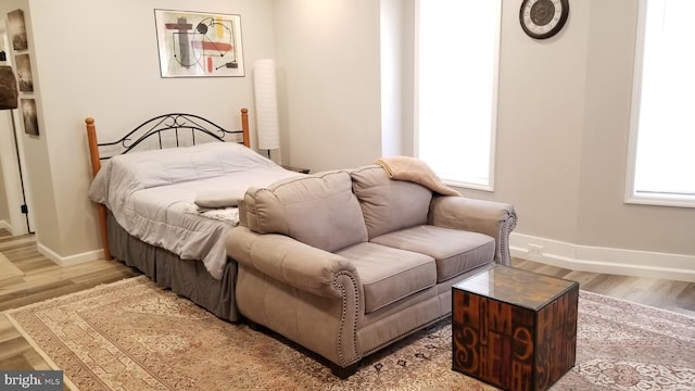 bedroom with baseboards and light wood-style floors