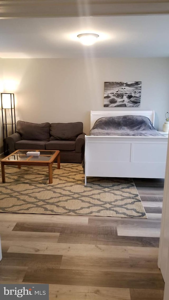 bedroom with wood finished floors