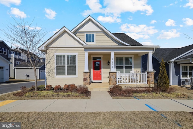 view of front of house featuring covered porch and roof with shingles