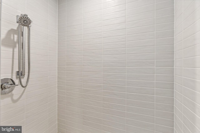 bathroom with tiled shower