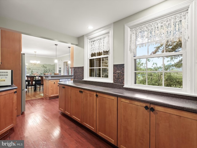 11116 Liberty Rd, Owings Mills, MD 21117 - kitchen featuring freestanding refrigerator, dark countertops, and a chandelier