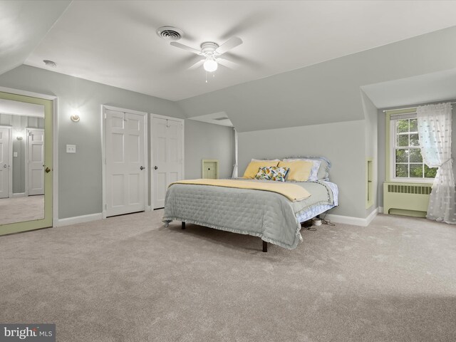 11116 Liberty Rd, Owings Mills, MD 21117 - carpeted bedroom with radiator heating unit, lofted ceiling, baseboards, a ceiling fan, and multiple closets
