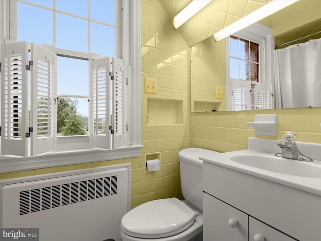 11116 Liberty Rd, Owings Mills, MD 21117 - full bath with radiator, tile walls, vanity, and toilet