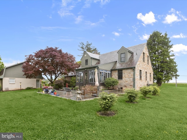 11116 Liberty Rd, Owings Mills, MD 21117 - view of side of property with a patio area, stone siding, a sunroom, and a lawn