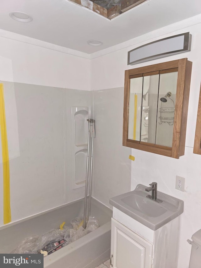 bathroom featuring tub / shower combination and vanity