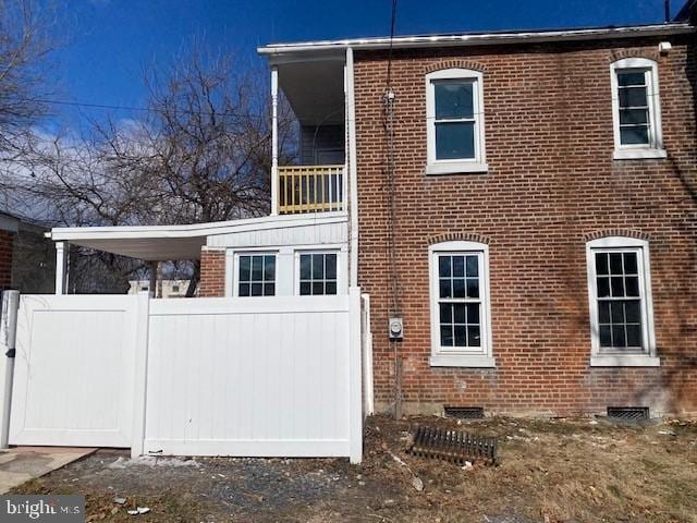 exterior space featuring brick siding and crawl space