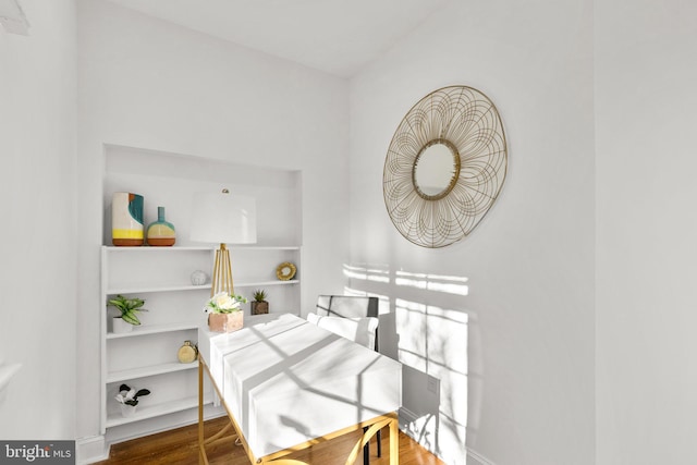 dining space with wood finished floors