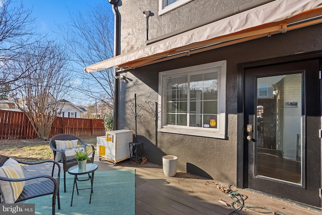 wooden deck featuring fence