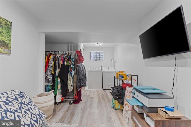 interior space featuring light wood-style floors, visible vents, and independent washer and dryer