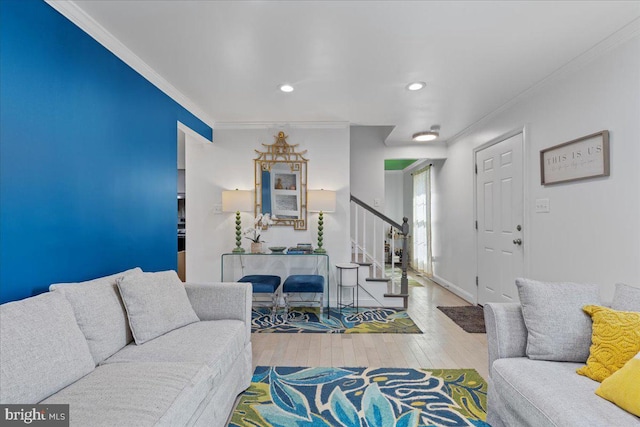 living room with light wood-style floors, stairs, crown molding, and recessed lighting