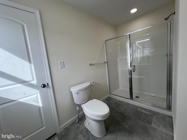 bathroom with recessed lighting, a shower stall, toilet, and baseboards