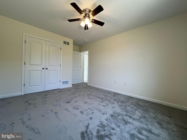 unfurnished bedroom featuring baseboards, visible vents, and carpet flooring