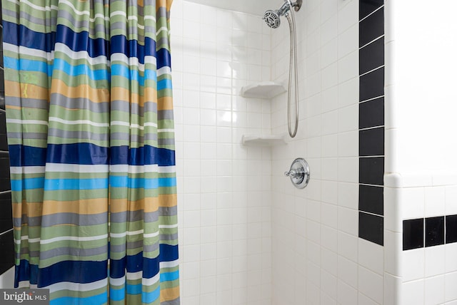 full bathroom with a tile shower