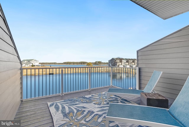 wooden terrace with a water view