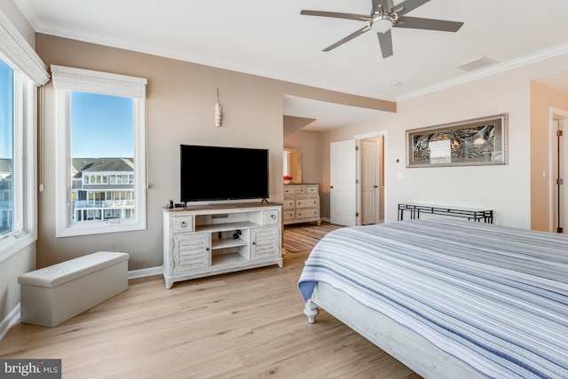 bedroom with baseboards, visible vents, a ceiling fan, ornamental molding, and light wood-type flooring