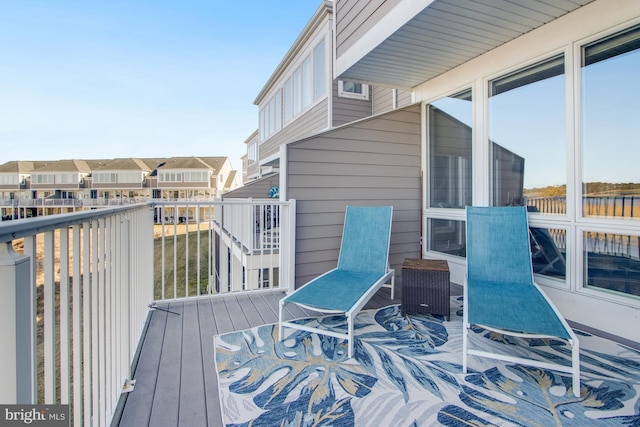 wooden terrace featuring a residential view