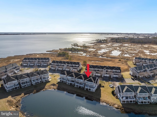 bird's eye view with a water view and a residential view