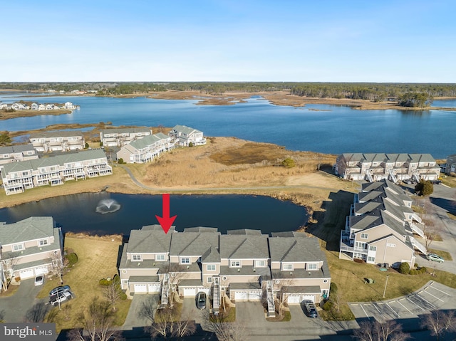 aerial view with a residential view and a water view