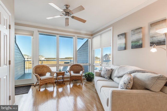 sunroom featuring a ceiling fan