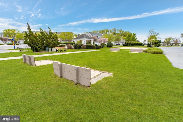 exterior space featuring a lawn and a gazebo