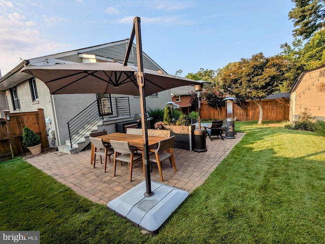 view of patio / terrace with outdoor dining space, area for grilling, fence, and an outdoor living space