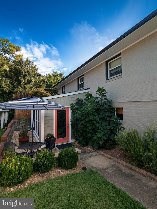 exterior space with brick siding