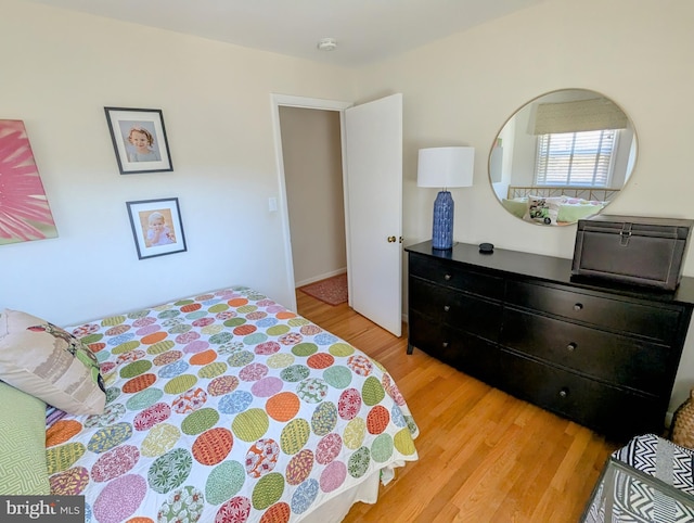 bedroom featuring light wood finished floors