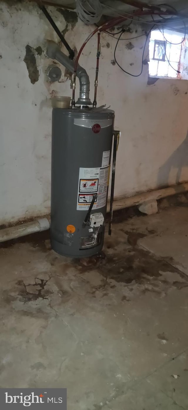 utility room featuring gas water heater