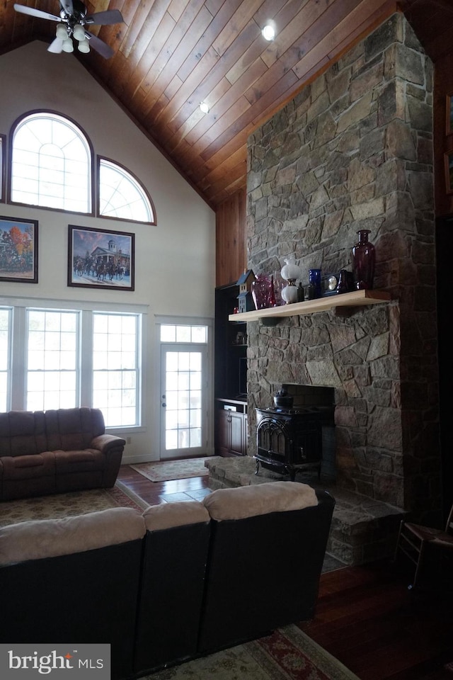 living room with high vaulted ceiling, wood ceiling, and a ceiling fan