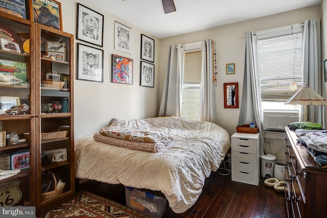 bedroom featuring dark wood-type flooring and a ceiling fan