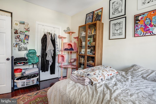 bedroom with a closet and wood finished floors