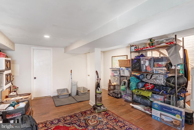 workout area with wood finished floors and baseboards