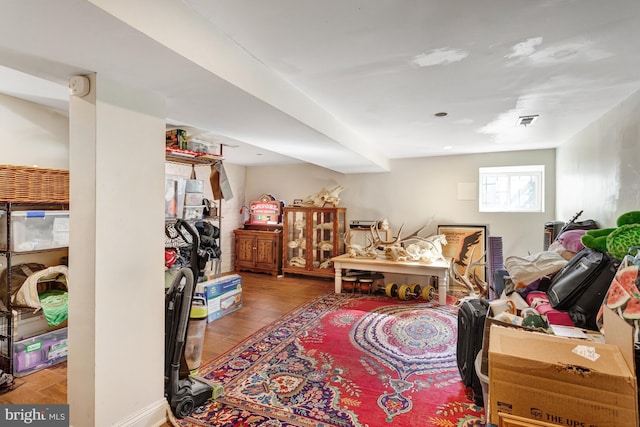 interior space with visible vents and wood finished floors