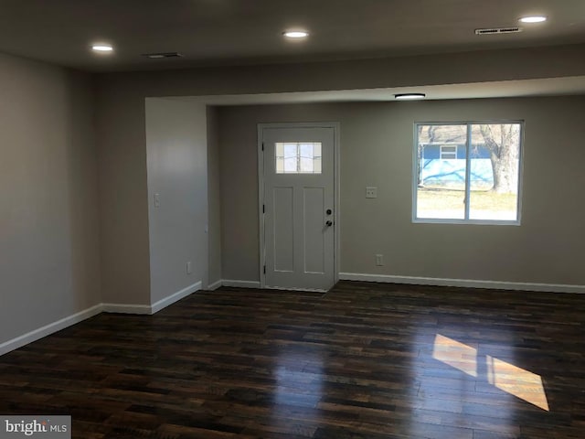 foyer with recessed lighting, dark wood-style flooring, visible vents, and baseboards