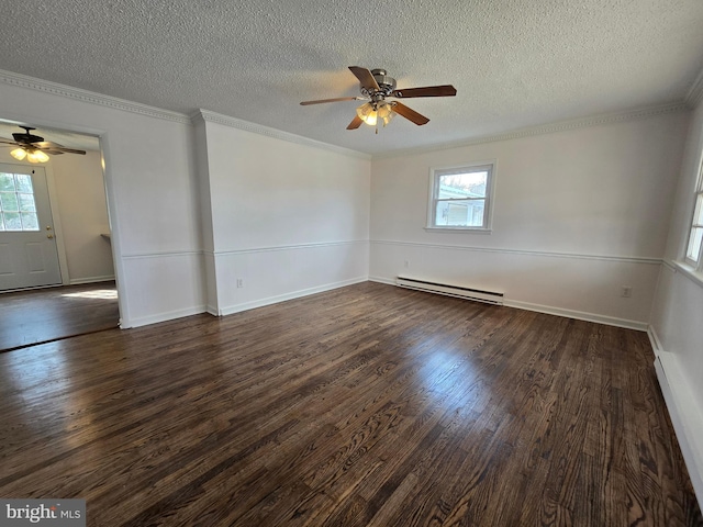 empty room with a wealth of natural light, crown molding, a baseboard heating unit, and dark wood-style flooring