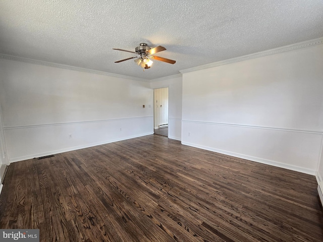 spare room featuring dark wood finished floors, visible vents, ornamental molding, a ceiling fan, and a textured ceiling