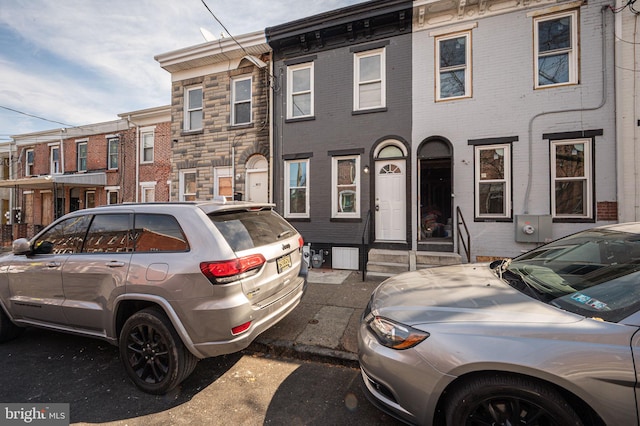 townhome / multi-family property with brick siding