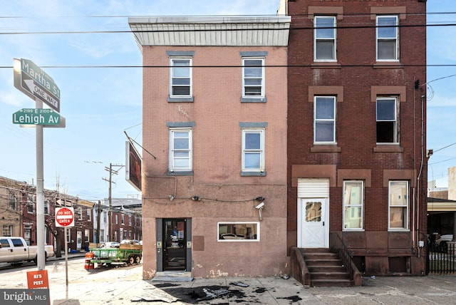 townhome / multi-family property featuring brick siding